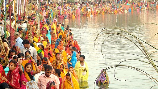 People gathered at a pond in Janakpurdham, Nepal to worship Surya, the sun god and his sister Chhathi Maiya